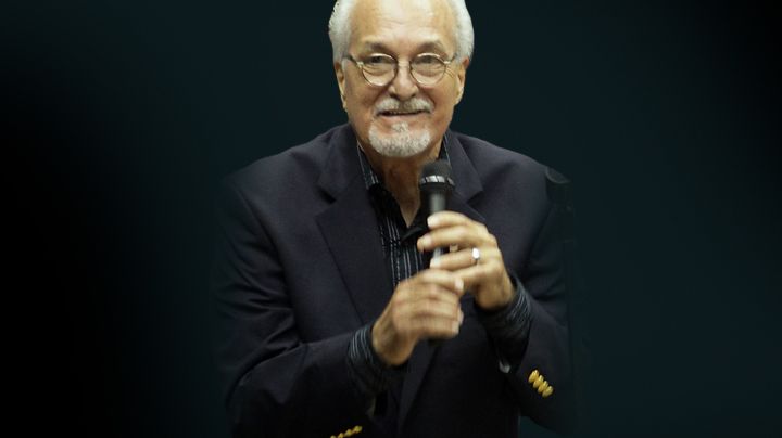 Paquito Guzman performs at the funeral service for Cheo Feliciano at Coliseo Roberto Clemente on April 20, 2014 in San Juan, Puerto Rico.
