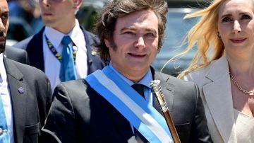 Argentina's new President Javier Milei L and his sister Karina Milei head for the Casa Rosada Presidential Palace in Buenos Aires, Argentina, Dec. 10, 2023. Javier Milei, a liberal politician and economist, assumed the Argentine presidency Sunday in a ceremony held at the National Congress in Buenos Aires, the country's capital. The outgoing head of state, Alberto Fernandez, placed the presidential sash and handed the baton of command to Milei, whose term will last for four years, until Dec. 10, 2027. (Photo by German Adrasti/Xinhua via Getty Images)_Argentina's president