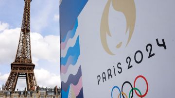 PARIS, FRANCE - JUNE 17: The Paris 2024 logo is displayed near the Eiffel Tower before the start of the Paris 2024 Olympic and Paralympic Games on June 17, 2024 in Paris, France. The city is gearing up to host the XXXIII Olympic Summer Games, from 26 July to 11 August. (Photo by Chesnot/Getty Images)
